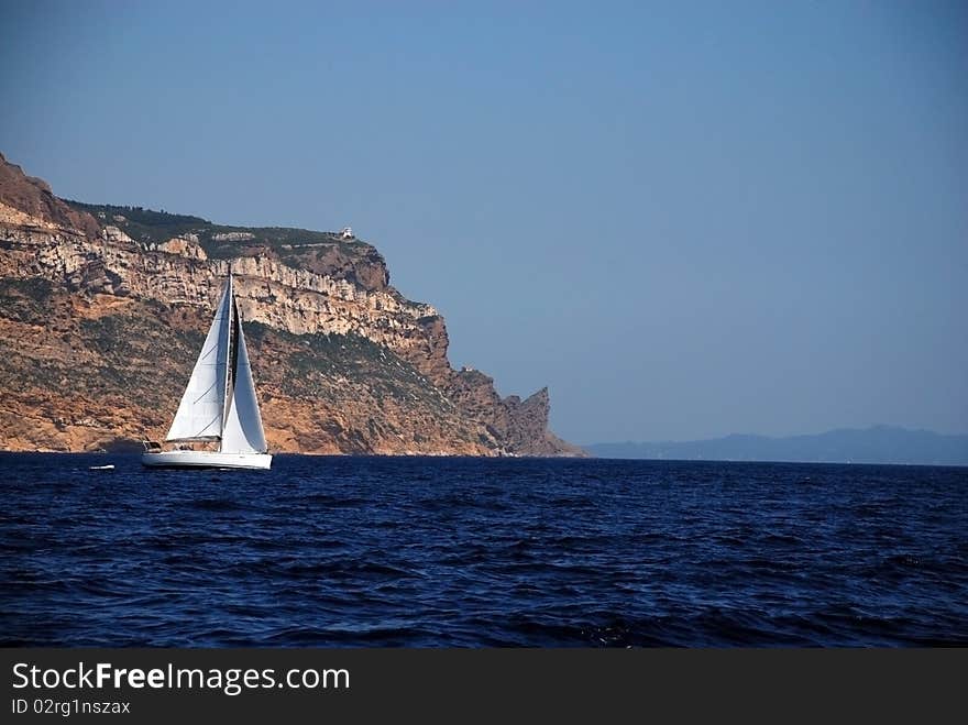 White sail yachts over rock in cassis France