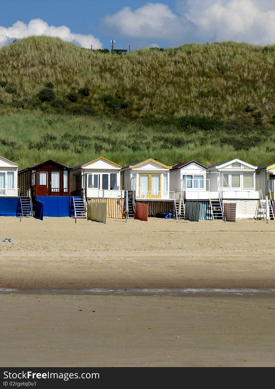 Wooden beach houses on the beach of Holland