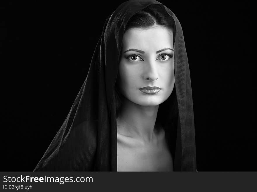 Portrait of elegant beautiful woman in shawl