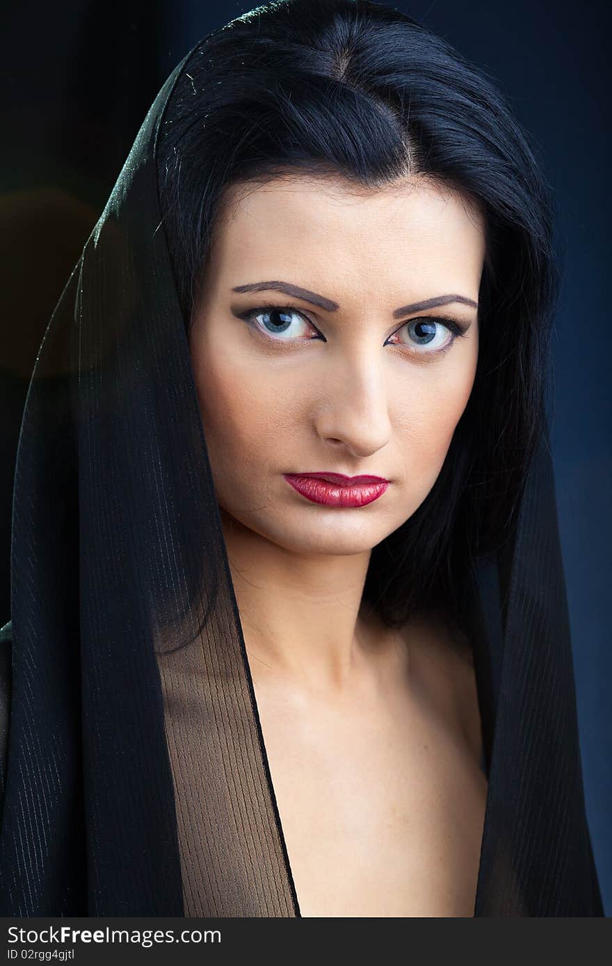 Portrait of elegant beautiful woman in shawl