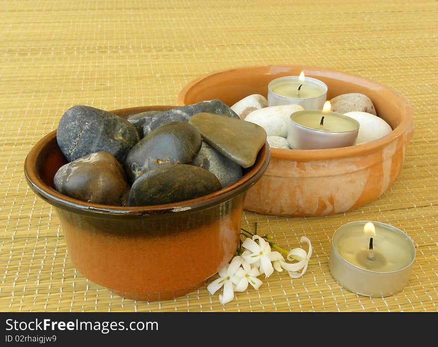 Spa. Massage stones, candles and jasmine