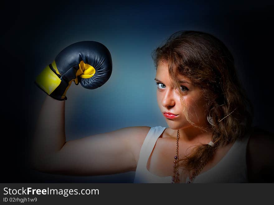 Young boxing woman showing power. Young boxing woman showing power