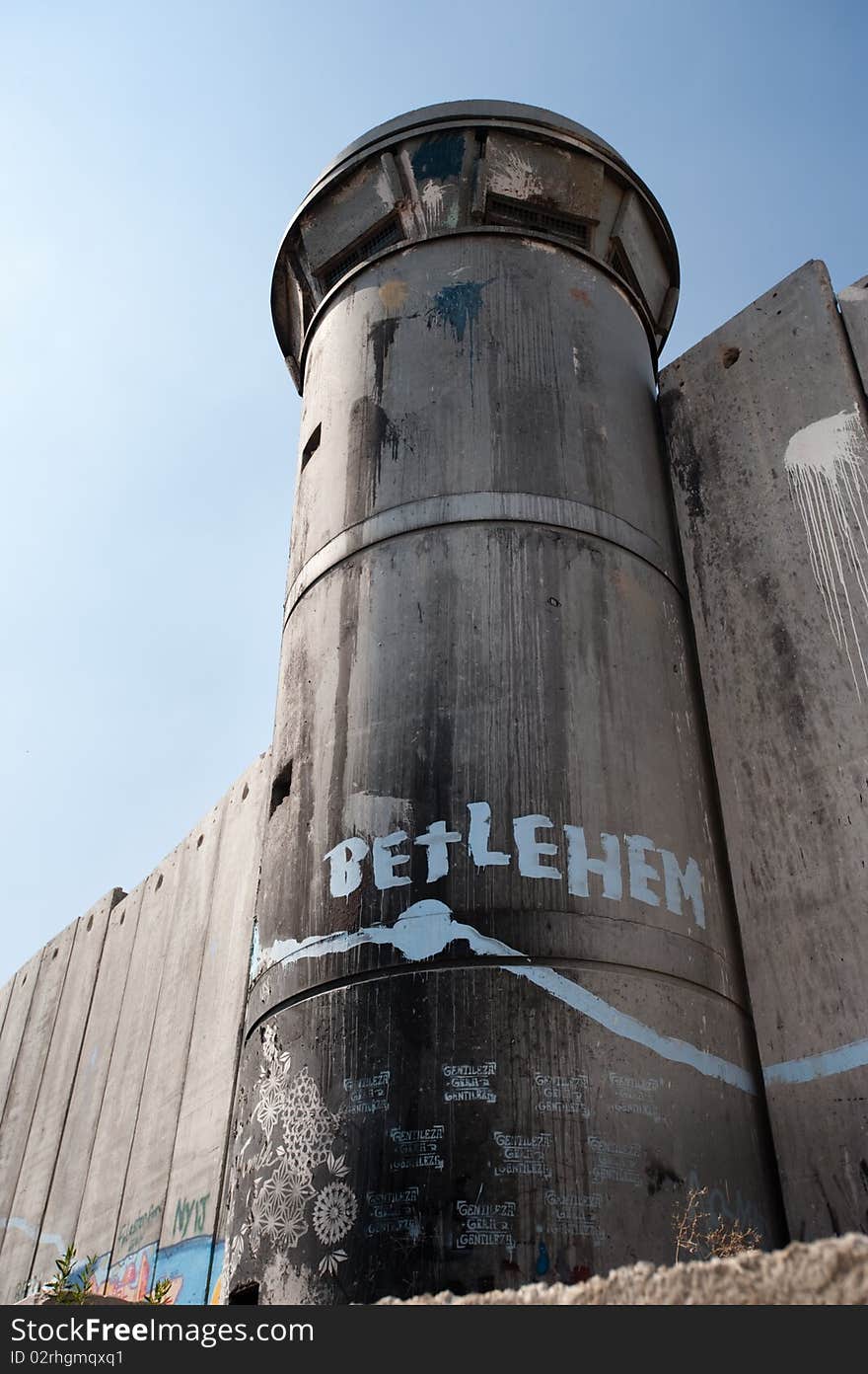 BETHLEHEM, OCCUPIED PALESTINIAN TERRITORIES - Activist graffiti adorns the Israeli separation wall and watch tower in the West Bank town of Bethlehem.