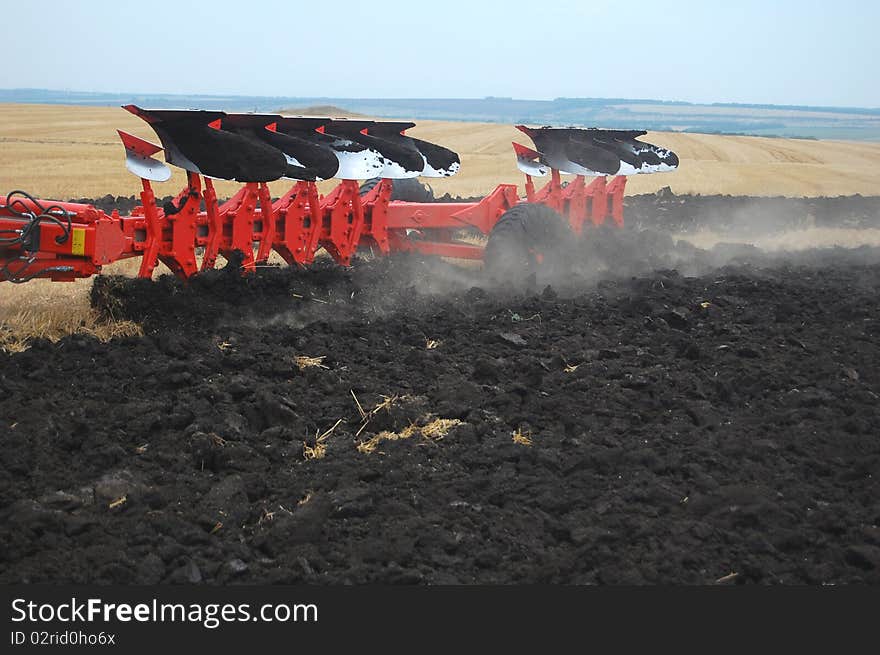 Workable plow with soil on furrows.