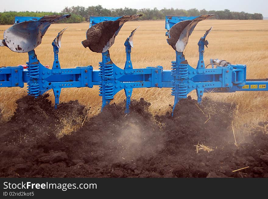 Workable plow with soil on furrows.