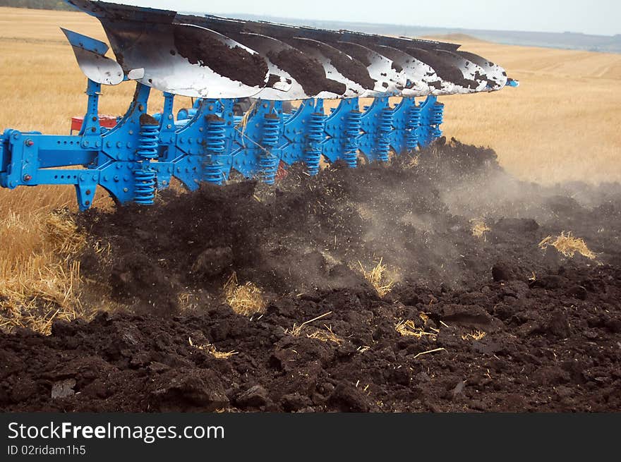 Workable plow with soil on furrows.