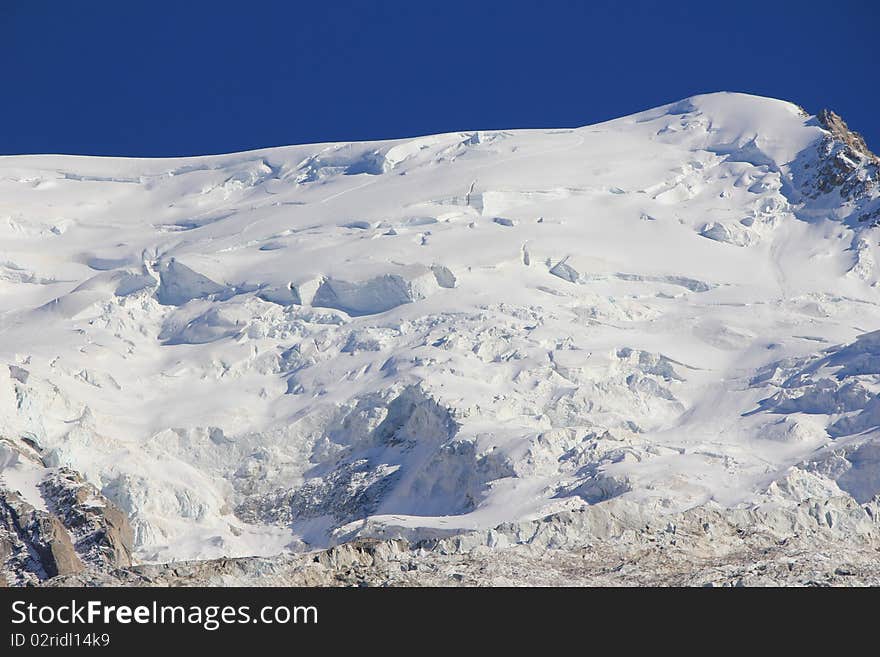 Mountain white and black and sky blue