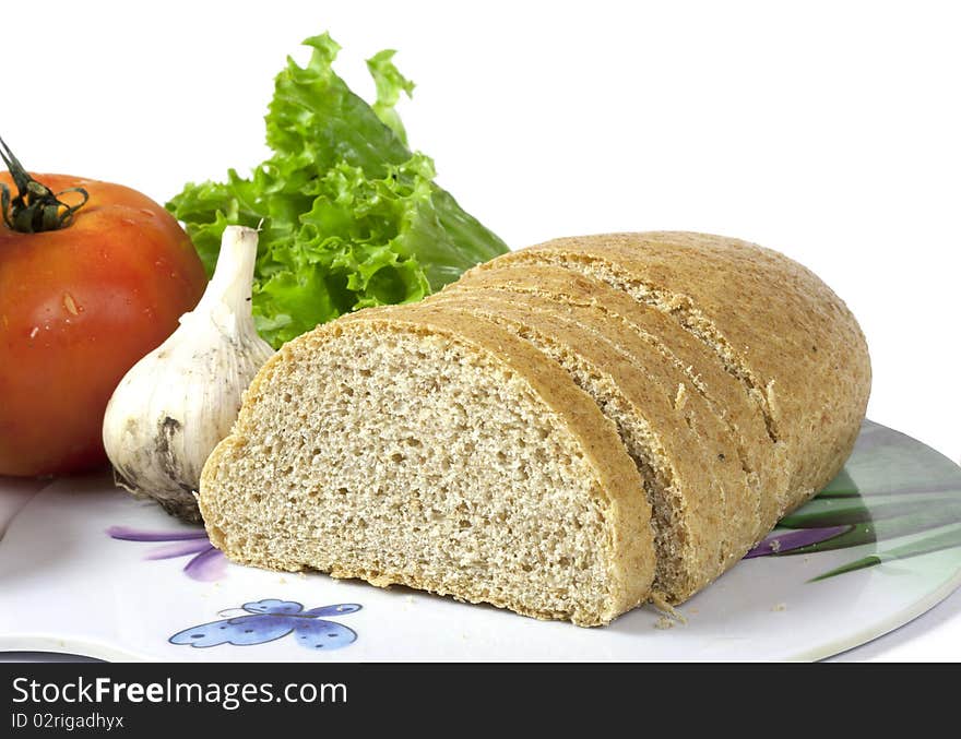 Bread and vegetables isolated on the white background