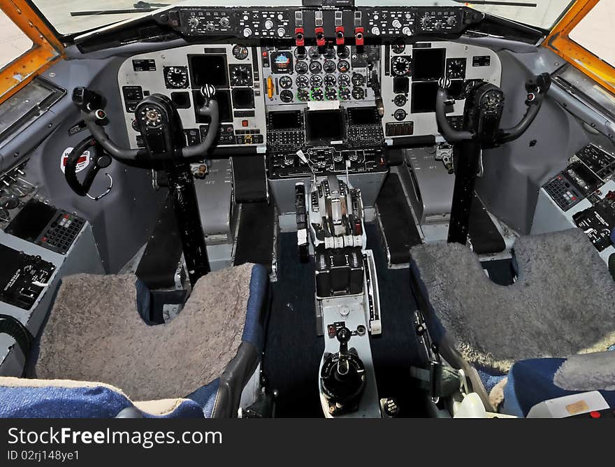 Classic jet airplane cockpit controls and seats