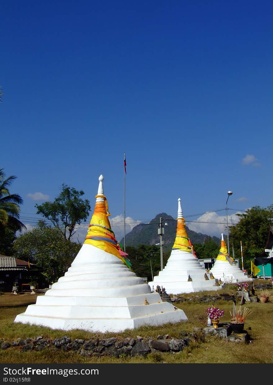 White big pagpda in thai village in bule sky. White big pagpda in thai village in bule sky