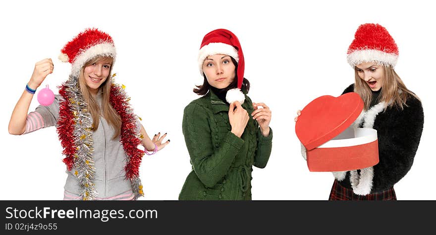 Three girls in christmas hat with gift on white background