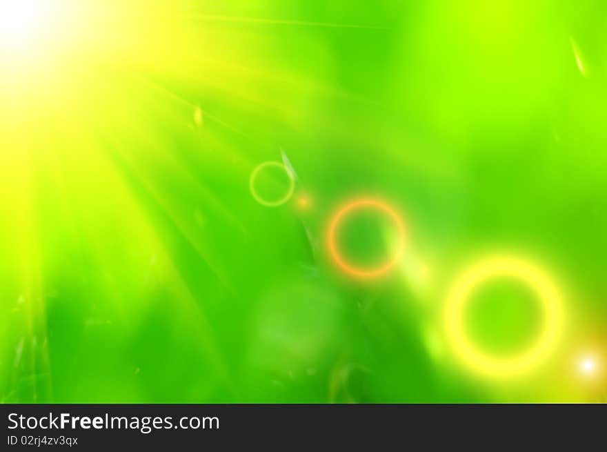 Abstract green background with yellow ray of light. Abstract green background with yellow ray of light.