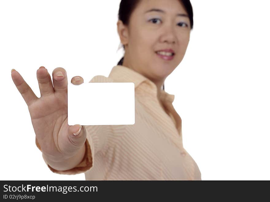 An Asian woman showing a blank business card. Clipping path included. An Asian woman showing a blank business card. Clipping path included.