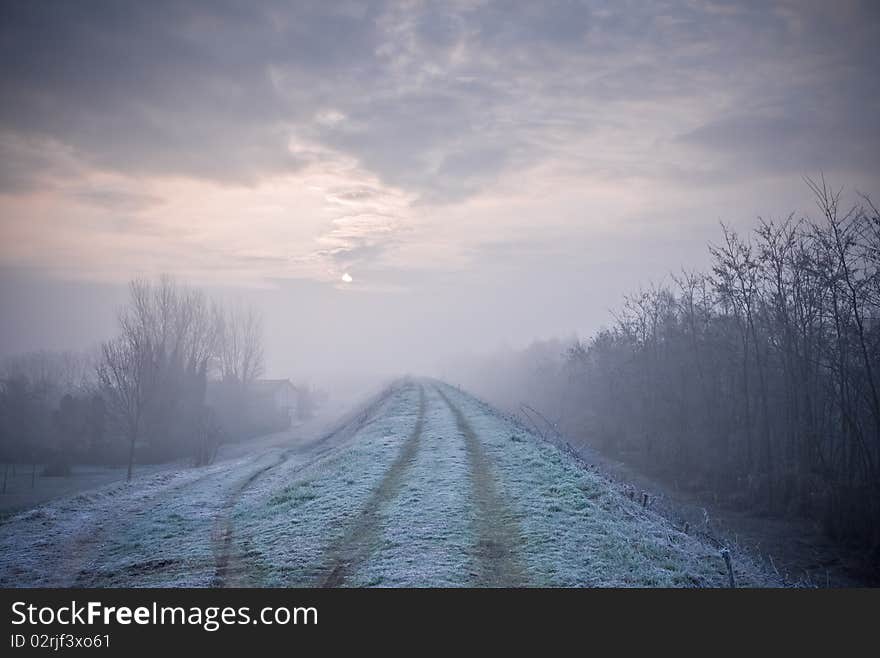 Dawn frost that forms near the river embankment settles like snow, Italy. Dawn frost that forms near the river embankment settles like snow, Italy