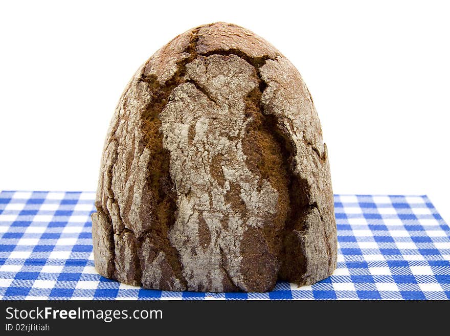 Bread onto blue-white table cloth. Bread onto blue-white table cloth