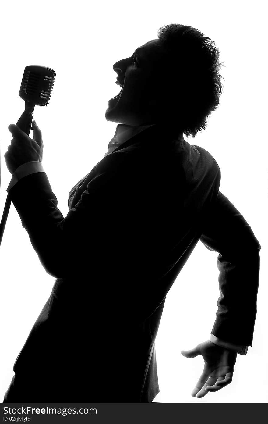 Man posing and singing in studio. Man posing and singing in studio