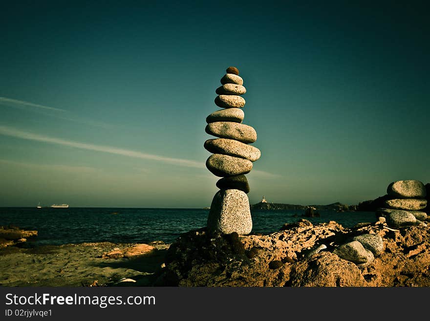 Tower of pebbles on the beach of Sardinia. Tower of pebbles on the beach of Sardinia