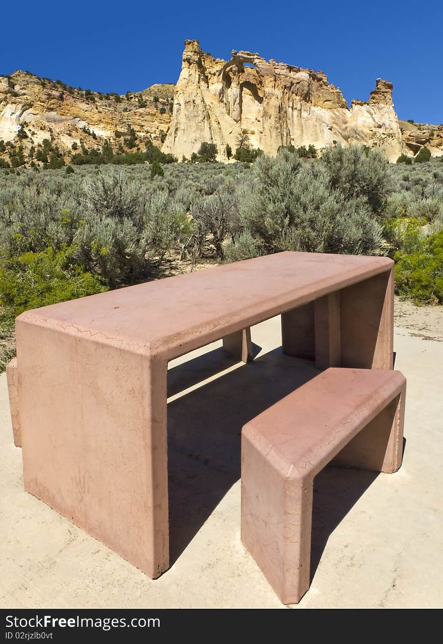 Grosvenor Arch, Utah with nice concrete picnic table in foreground. In the Escalante Grand Staircase National Park. Grosvenor Arch, Utah with nice concrete picnic table in foreground. In the Escalante Grand Staircase National Park.