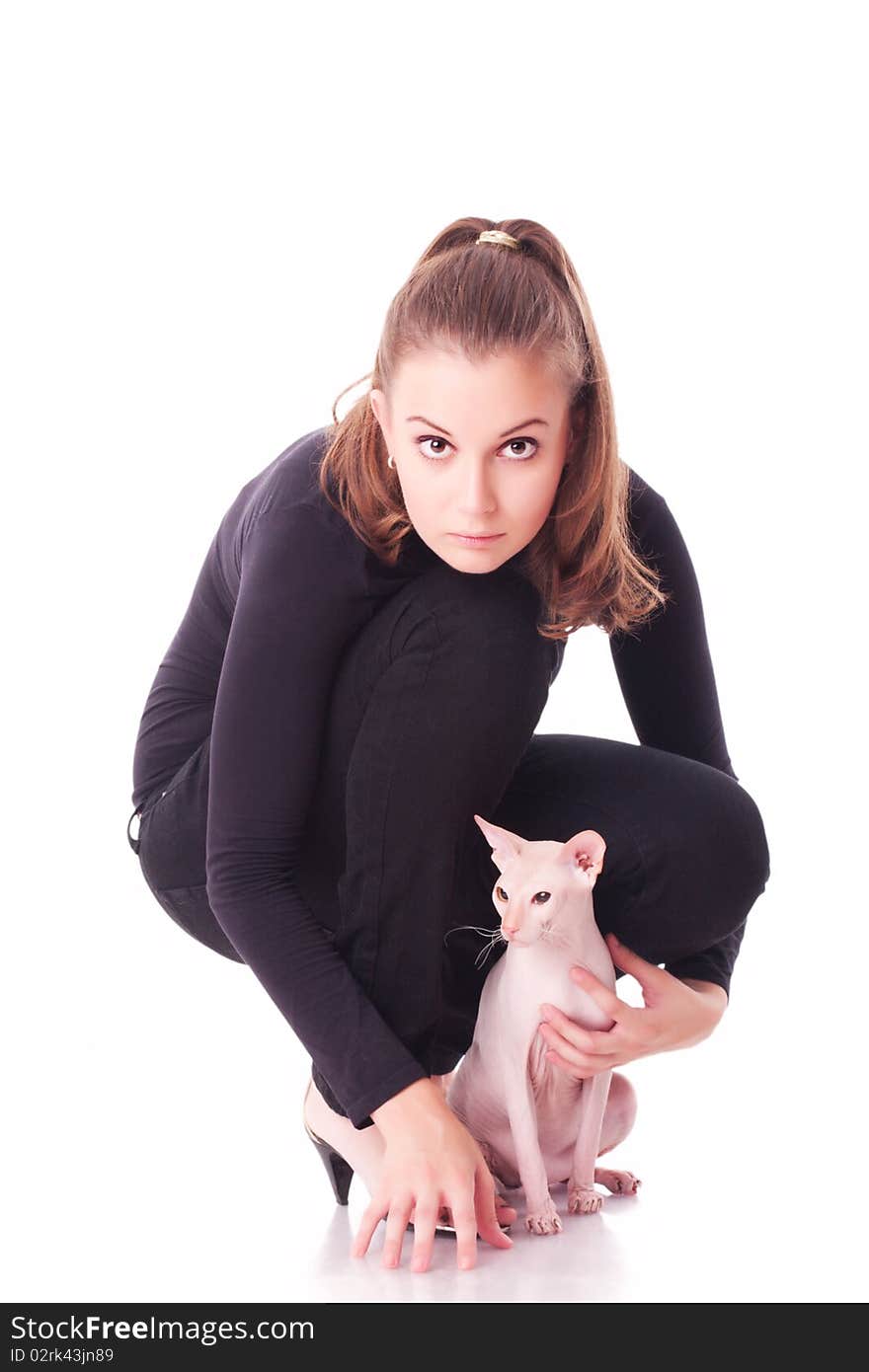 Beautiful young woman with a cat on a white background