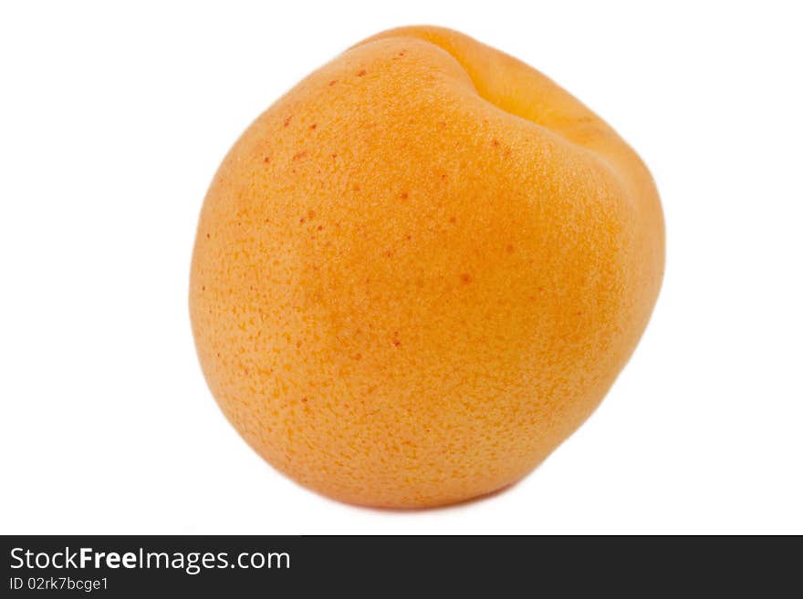 Isolated apricot over white background. Macro, fruit texture visible