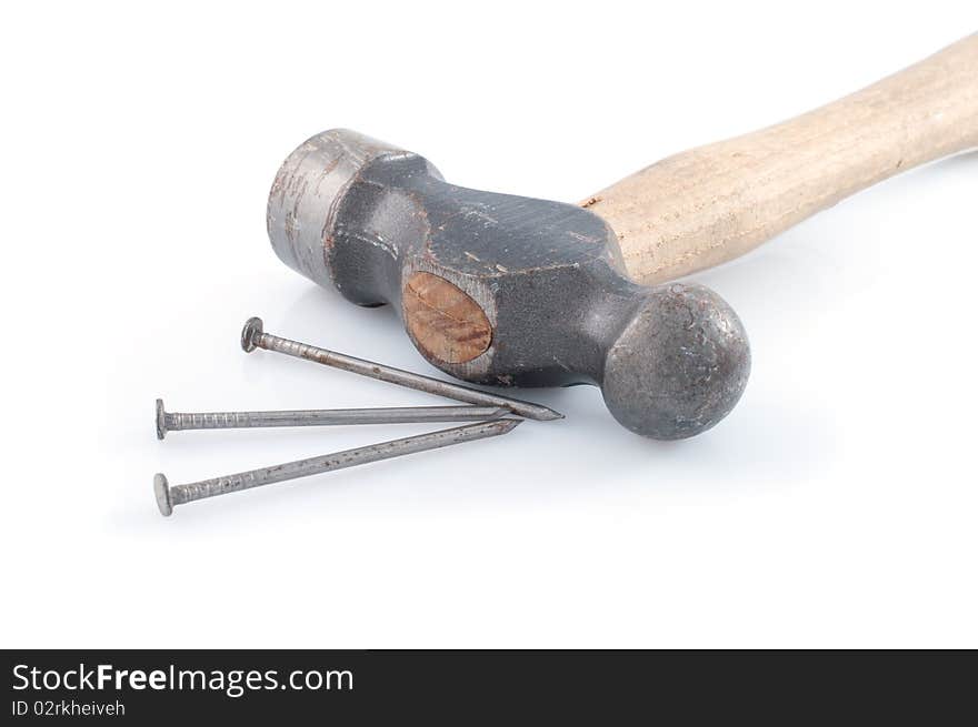 Hammer and nails on white background