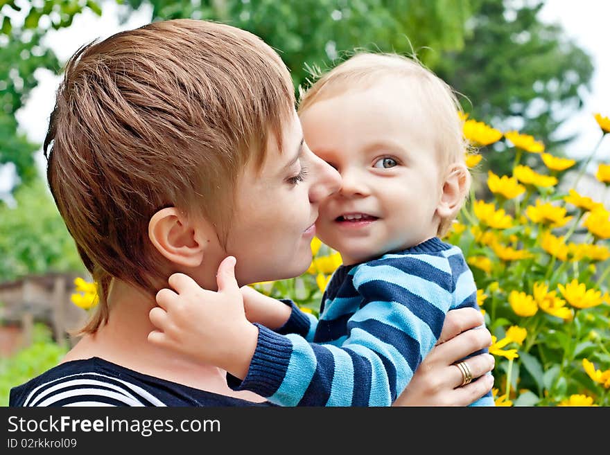 Mother embracing little son