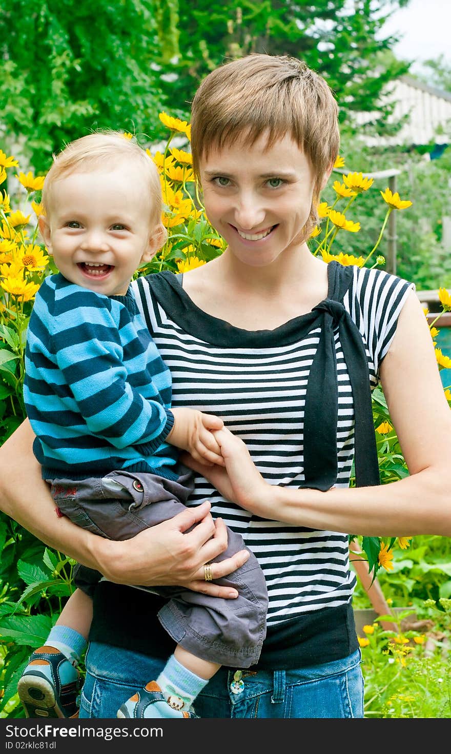 Portrait of mother and son in garden