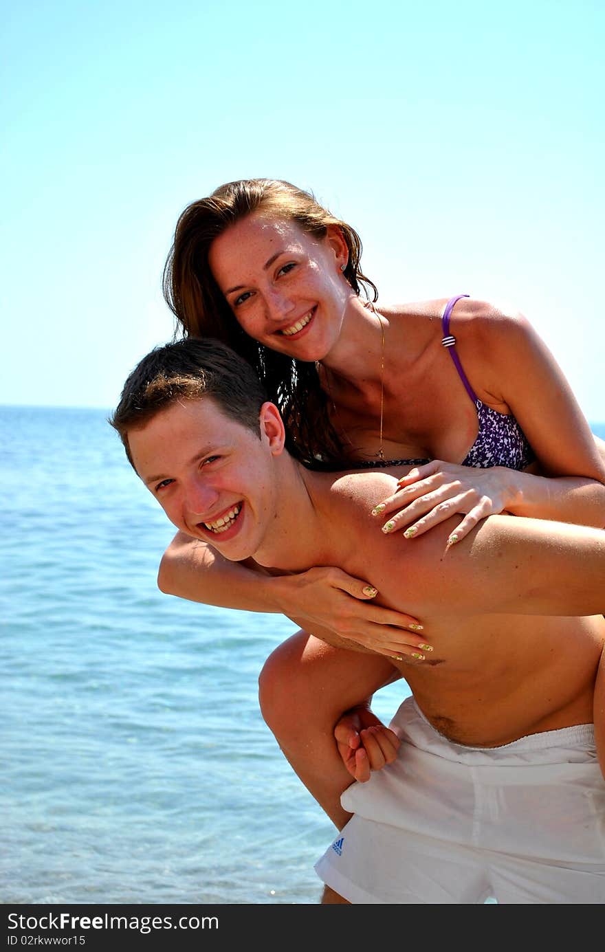 Couple in love embrace near the sea. Couple in love embrace near the sea