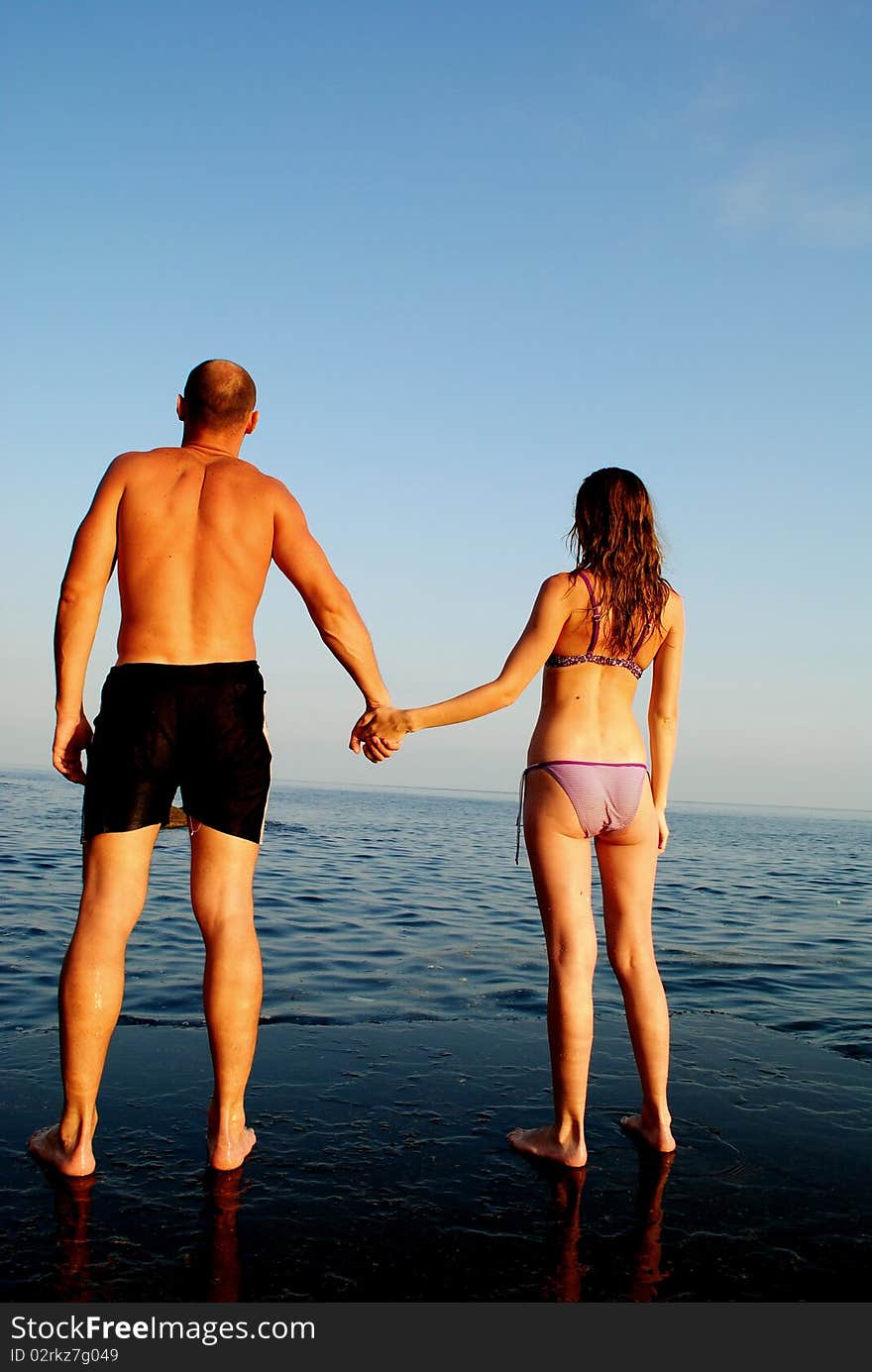 Summer fun on the beach for this loving couple