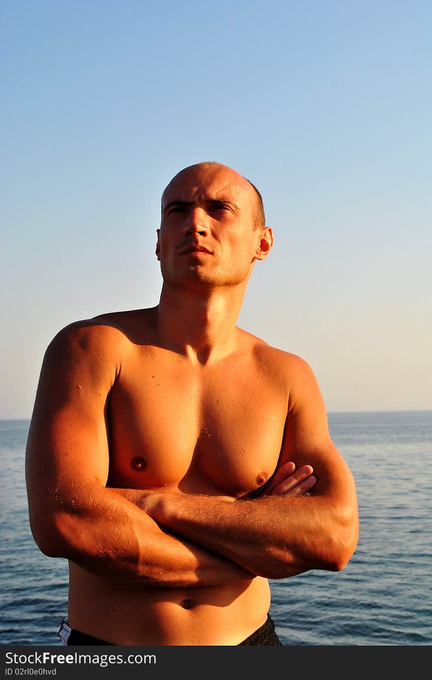 Man is sunbathing on the beach. Man is sunbathing on the beach