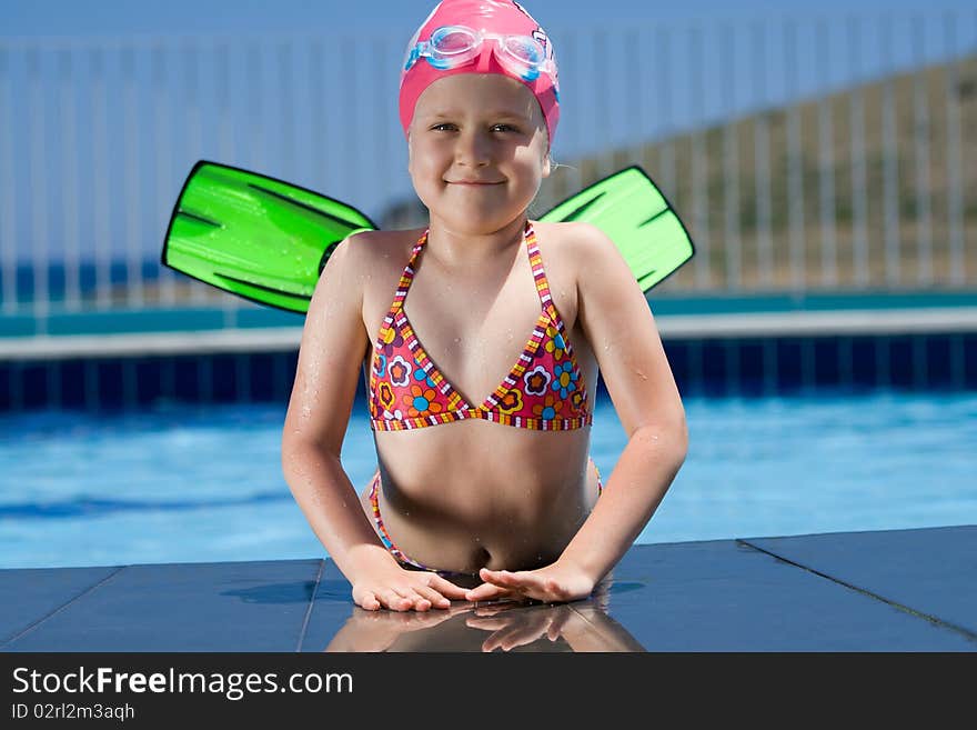 Little Child In Bathing Cap, Glasses, Fins Near Sw