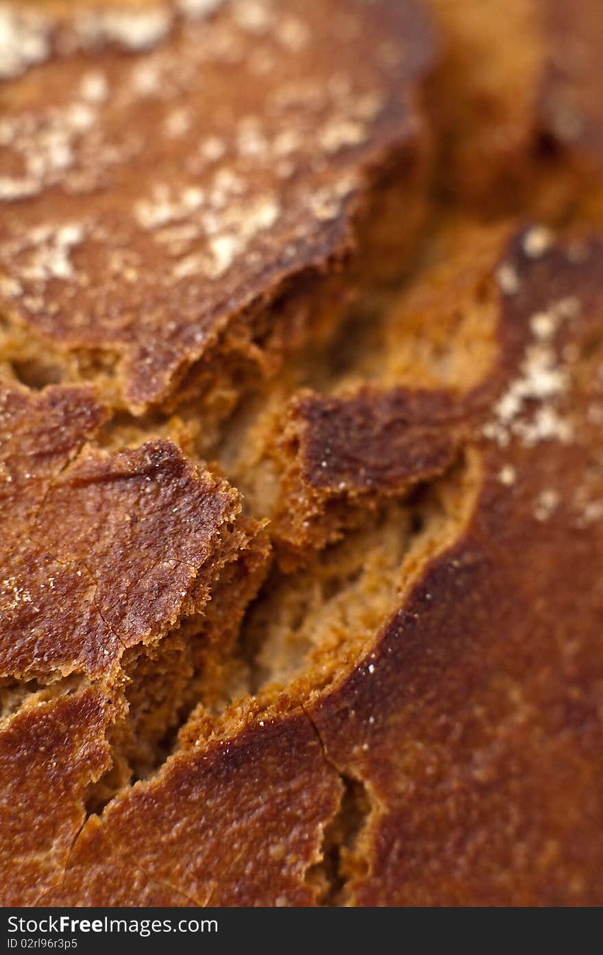 Brown bread detail, vertical photo, shallow depth of view