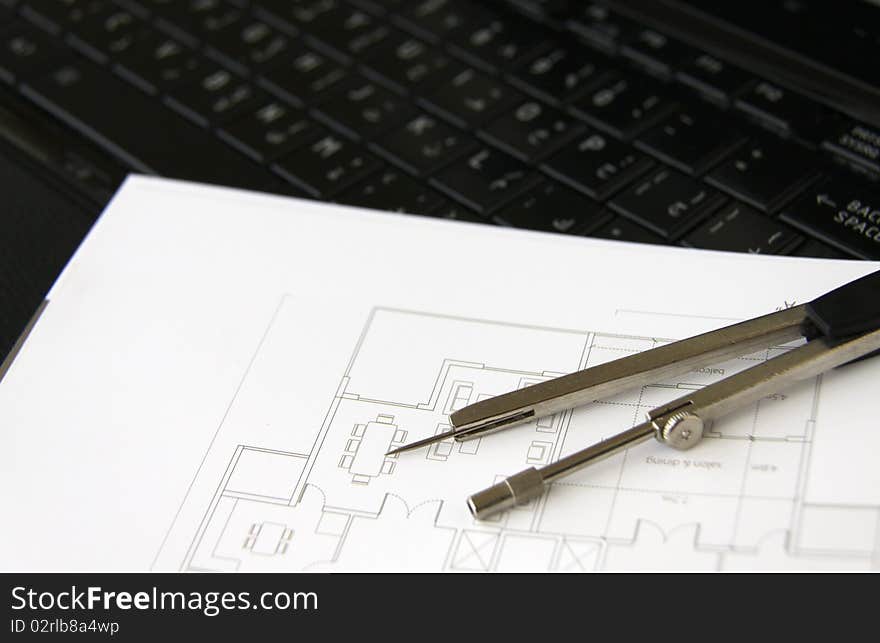 Architectural plan and campus on top of a laptop. Architectural plan and campus on top of a laptop