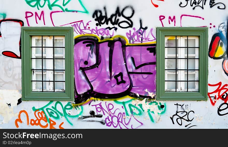 The wall of an old nursery school, covered with lively modern-time graffiti tags. Athens, Greece. The wall of an old nursery school, covered with lively modern-time graffiti tags. Athens, Greece.