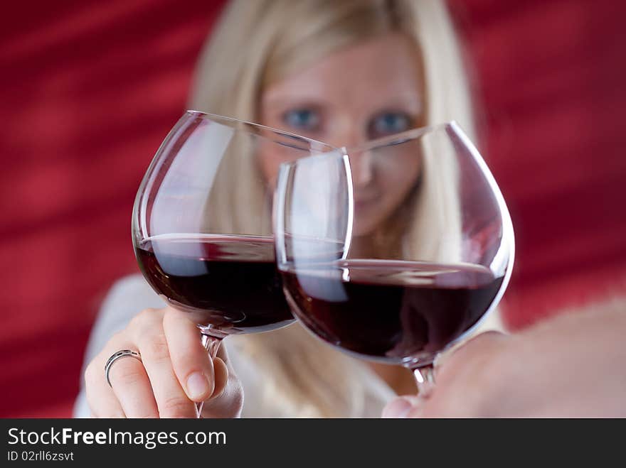 Young smiling women toast gesture with a man. Women looking into his eyes. Picture is take like from man eyes. Young smiling women toast gesture with a man. Women looking into his eyes. Picture is take like from man eyes.