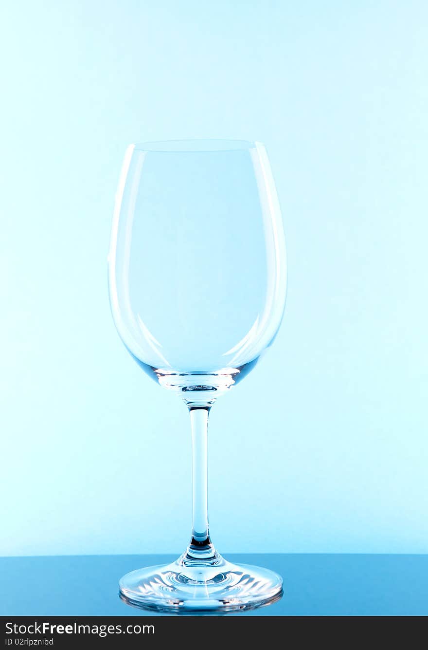 Red wine glass colored in blue