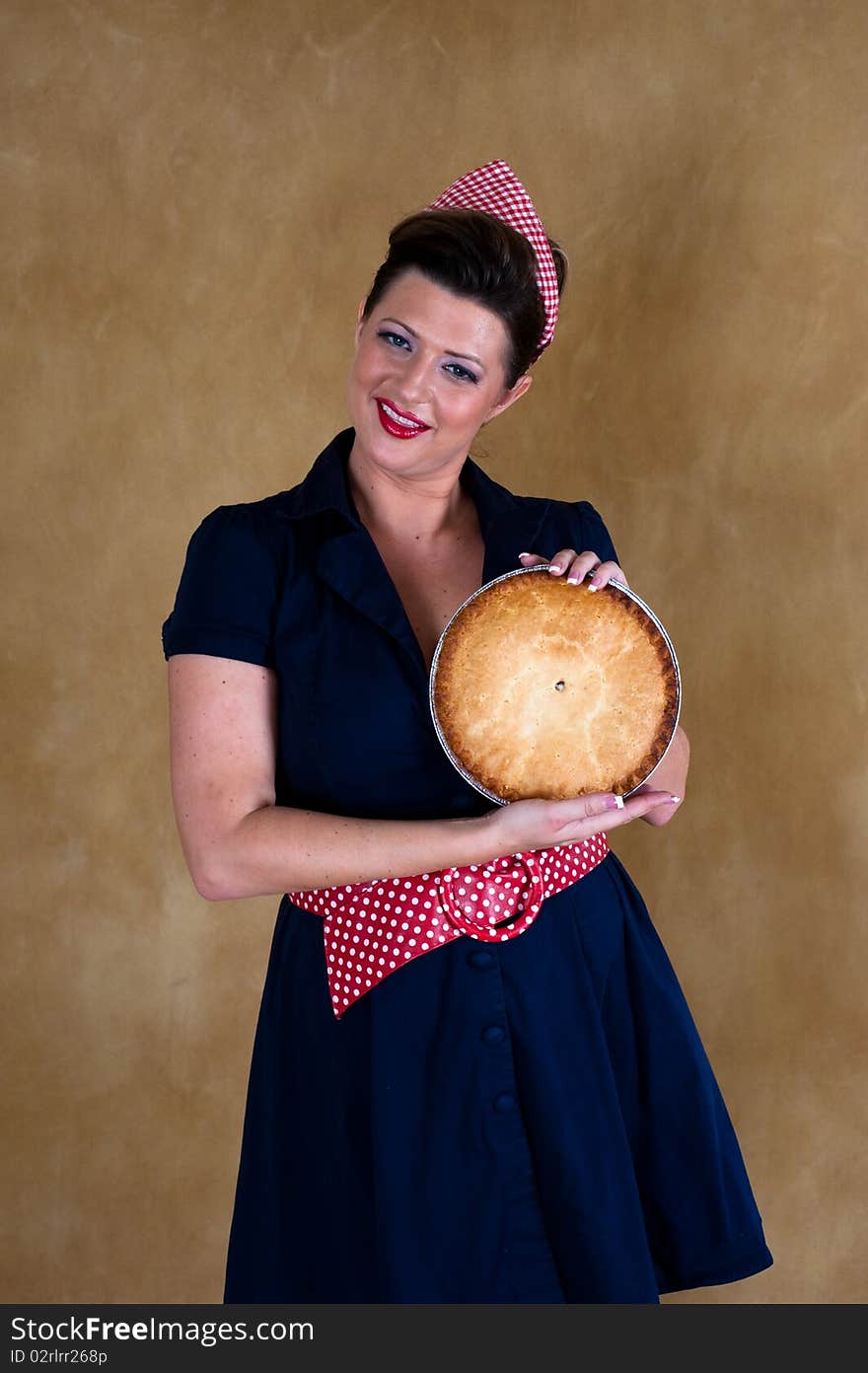 House wife with the pie in her hands. House wife with the pie in her hands