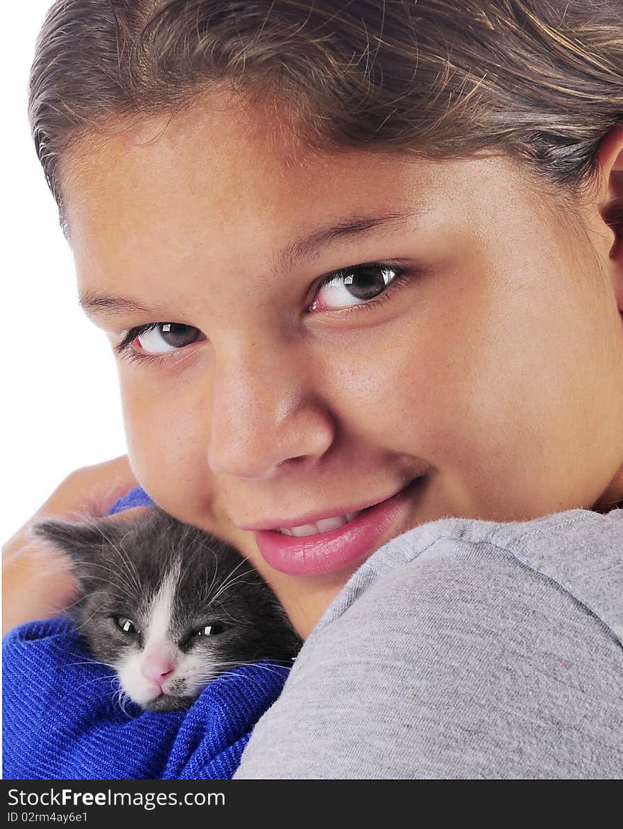 Close-up portrait of a young teen snuggling with her tiny gray and white kitten. Close-up portrait of a young teen snuggling with her tiny gray and white kitten.