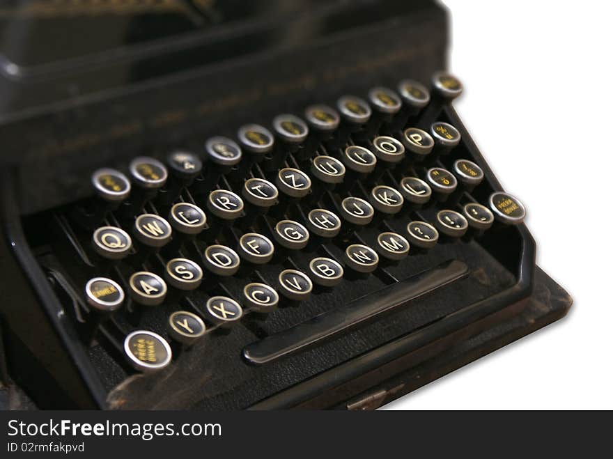 The old typewriter on a white background. The old typewriter on a white background