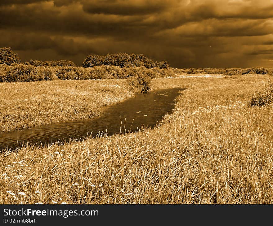 Field before thunderstorm