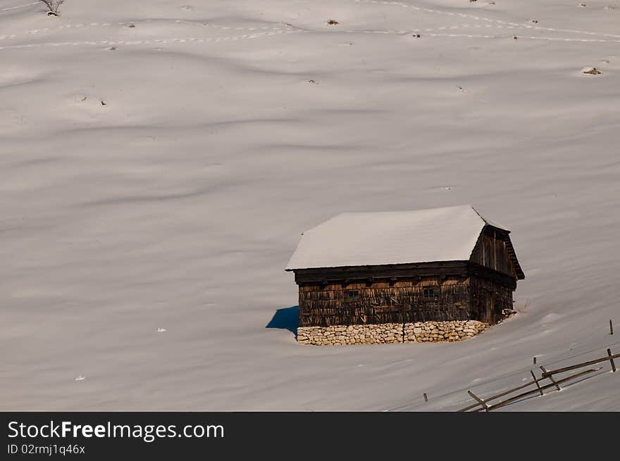 Mountain House in Winter Landscape