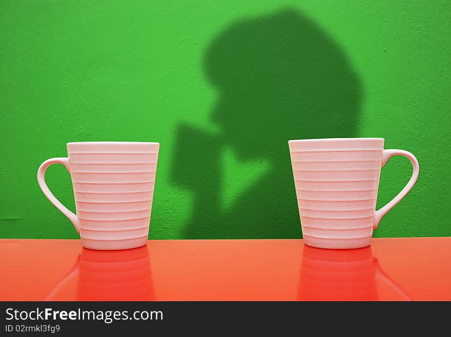 White cups on a colored background