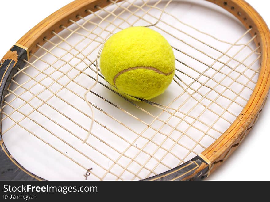 Old racket and tennis ball