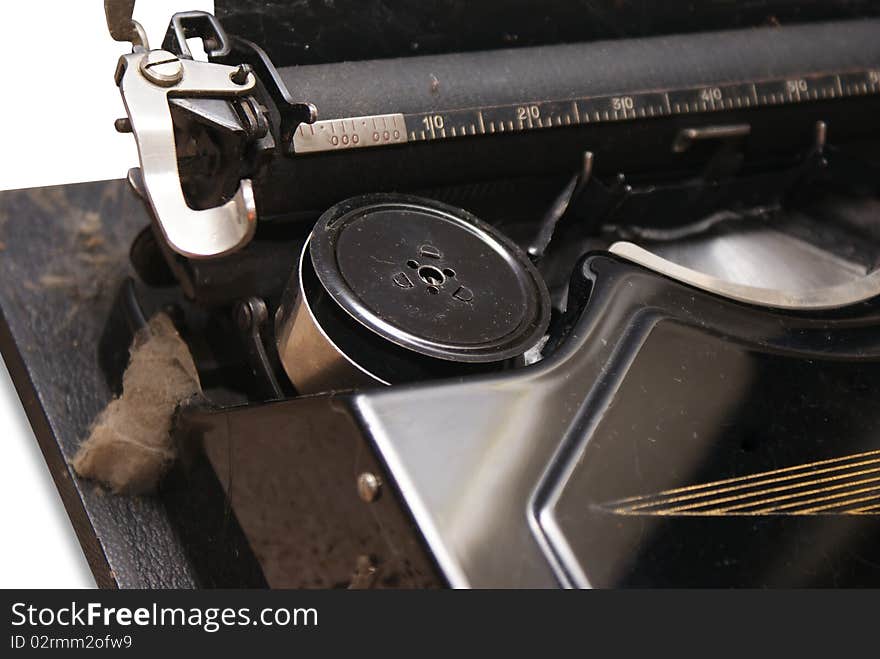 The old typewriter on a white background. The old typewriter on a white background