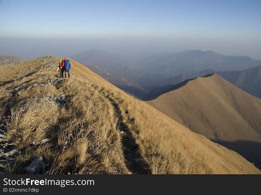 Backpackers are walking on the peak. Backpackers are walking on the peak.