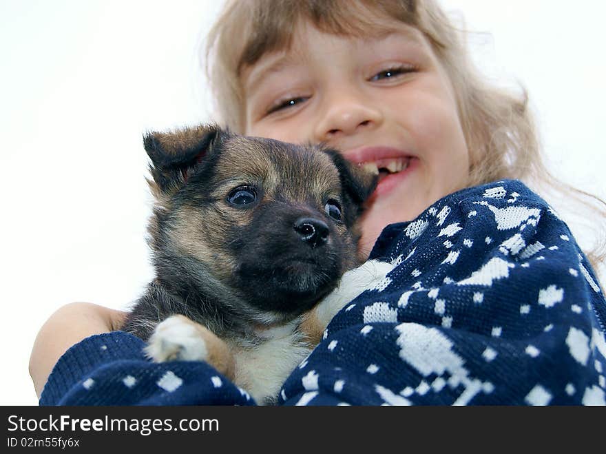 The girl holds a puppy