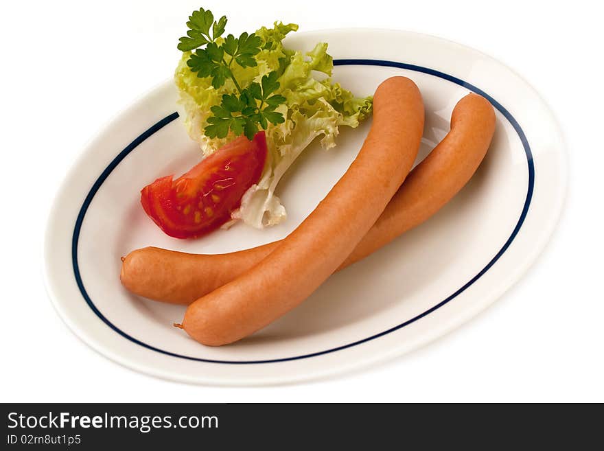 Portion of Sausage on Plate isolated on white Background