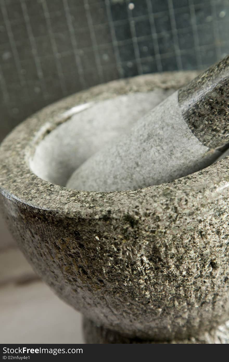 A mortar and pestle is a tool used to crush, grind, and mix solid substances (trituration). The pestle is a heavy bat-shaped object, the end of which is used for crushing and grinding. A mortar and pestle is a tool used to crush, grind, and mix solid substances (trituration). The pestle is a heavy bat-shaped object, the end of which is used for crushing and grinding.