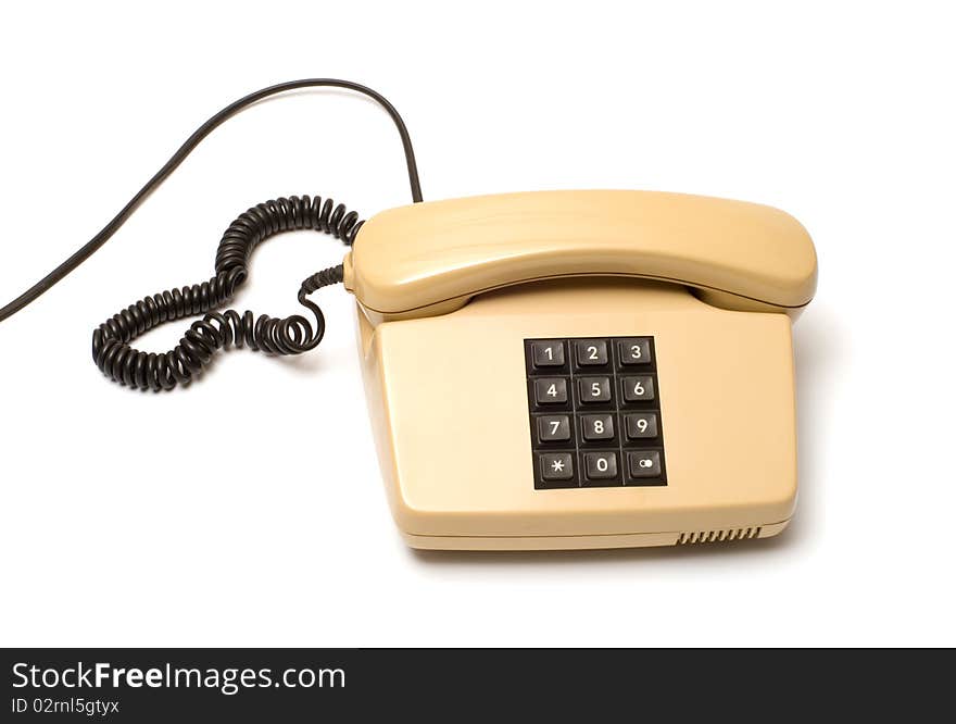 Old Beige key telephone system on a white background. Old Beige key telephone system on a white background.