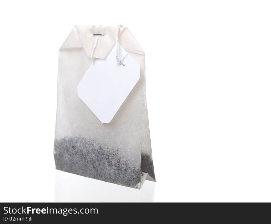 Close-up of tea bag isolated on white background